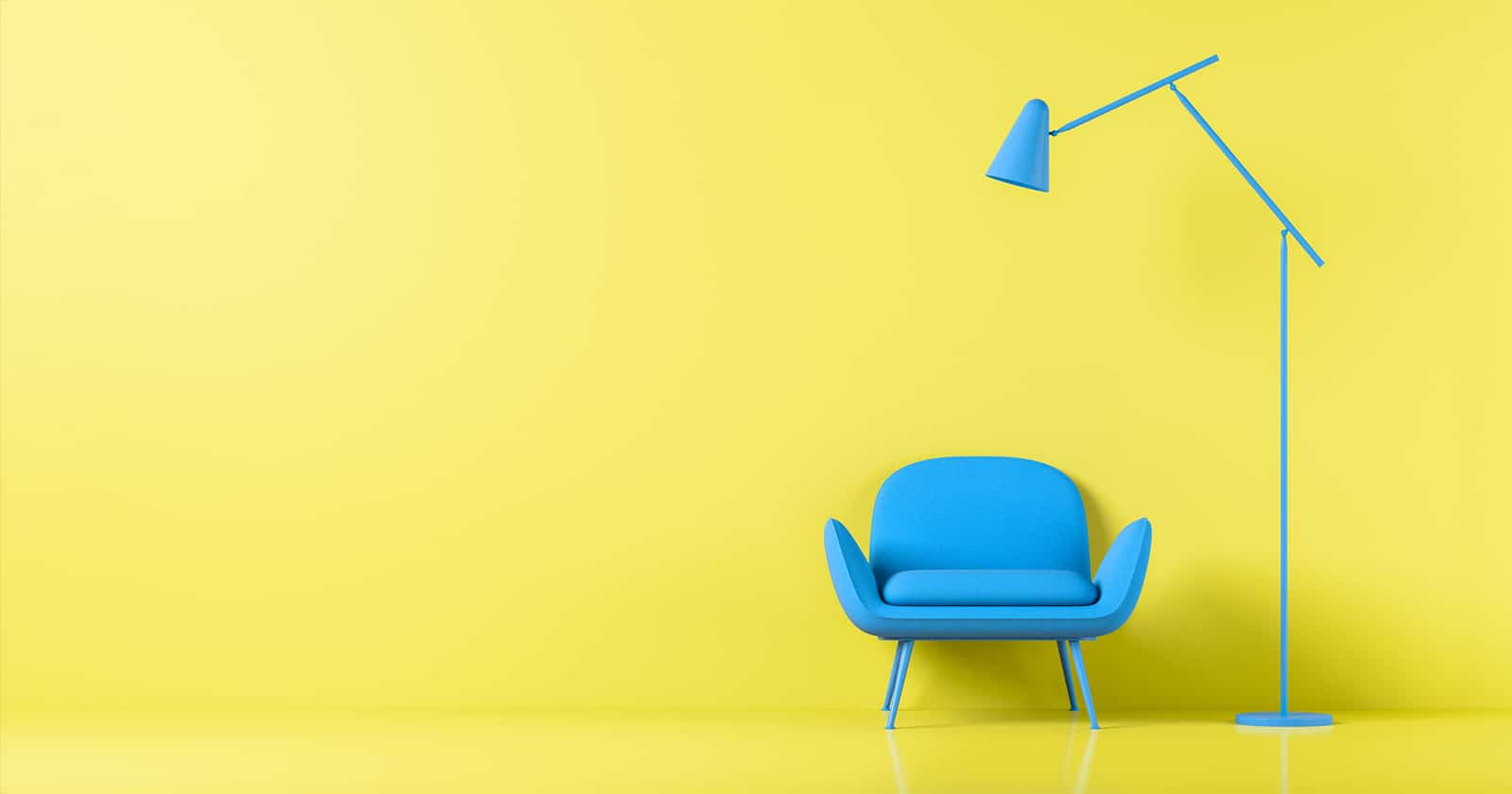 An Agile Focus on Minimalism – empty yellow space with a single blue chair and lamp